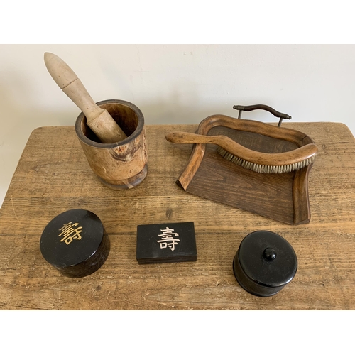 307 - A vintage wood crumb tray and brush plus a wood pestle and mortar and an ebony pot