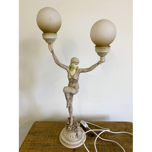 312 - A resin Art Deco style figural table lamp, 27