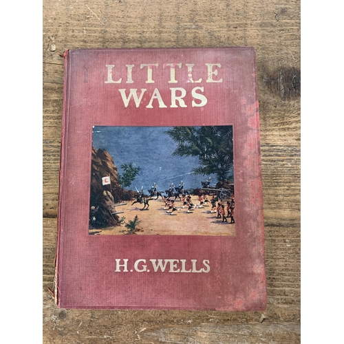 320 - A small selection of books including a 1939 first edition H G Wells 'Little Wars' (wear and damage t... 