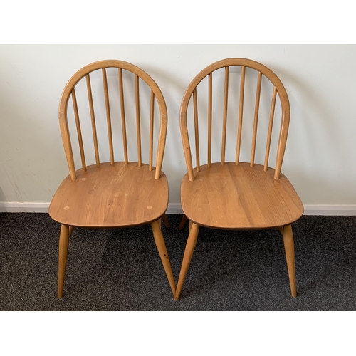 360 - A pair of mid century stick back chairs, marked B.S G.C 1960