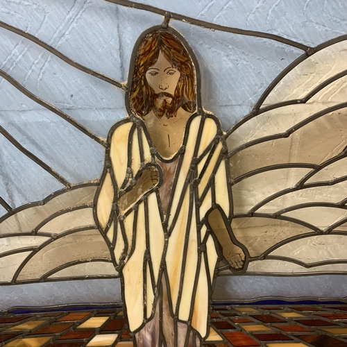 363 - A large wood framed leaded glass panel with painted face of Jesus with a dove, total size 45