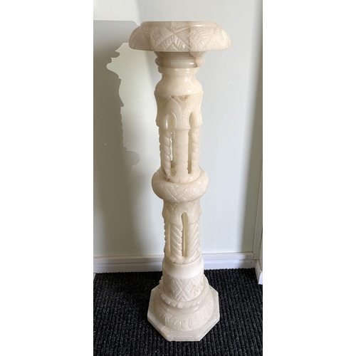 364 - A tall carved alabaster plant stand, approx. 40