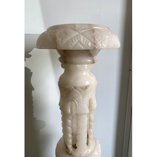 364 - A tall carved alabaster plant stand, approx. 40