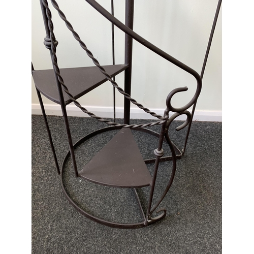 368 - An ornate tall metal constructed spiral staircase display stand, approx. 65