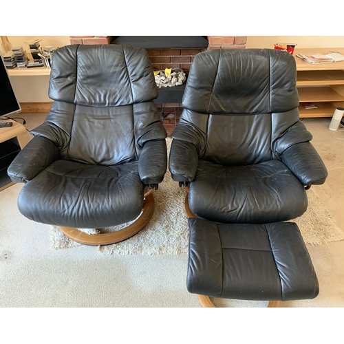 371 - A pair of black leather adjustable armchairs with wood bases and matching foot stool (signs of use)