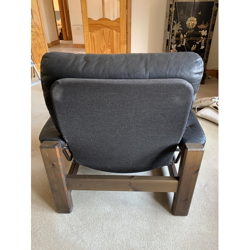 374 - A pair of vintage button back black leather adjustable armchairs, both with matching foot stools (ag... 