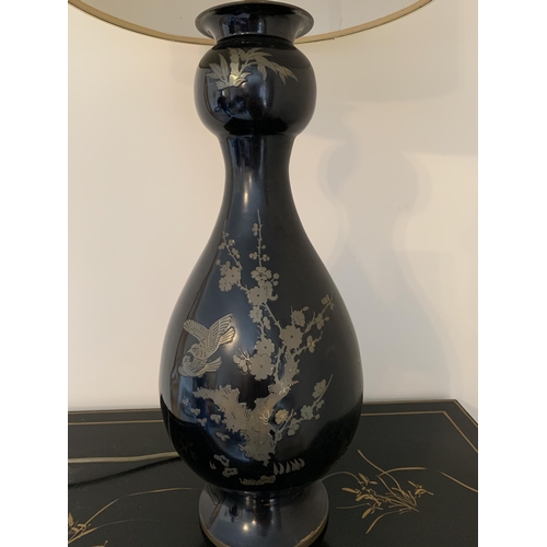 395 - An Oriental metal inlaid base table lamp decorated with birds, complete with shade, 34 3/4