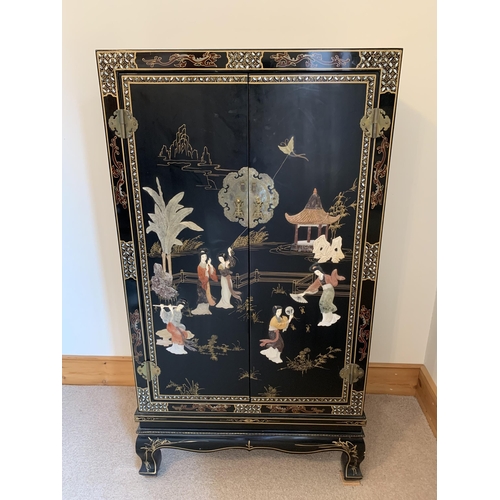 401 - A fine large vintage Chinese two door cabinet, decorated on three sides with applied coloured stones... 