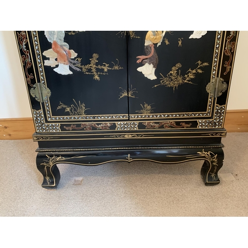 401 - A fine large vintage Chinese two door cabinet, decorated on three sides with applied coloured stones... 