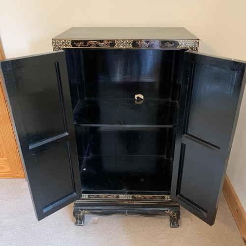 401 - A fine large vintage Chinese two door cabinet, decorated on three sides with applied coloured stones... 