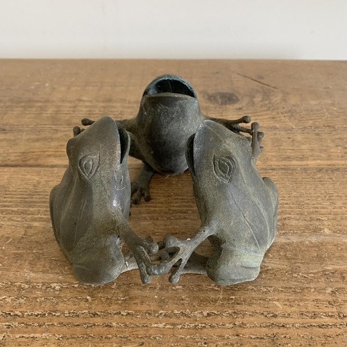 409 - A small bronze three frog figure garden ornament