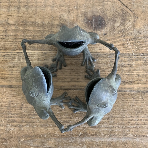 409 - A small bronze three frog figure garden ornament