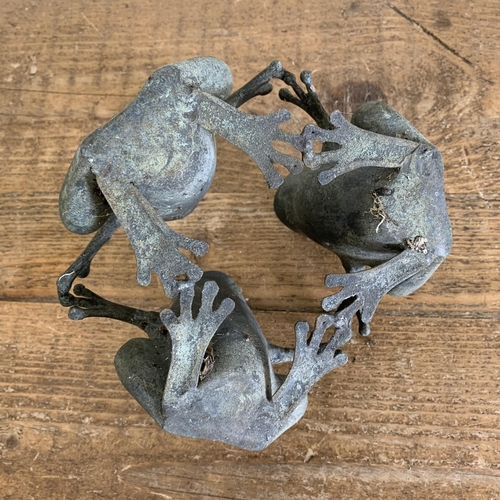 409 - A small bronze three frog figure garden ornament