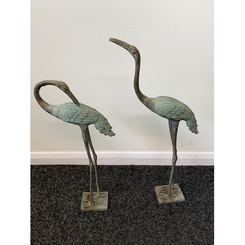 412 - Two bronze heron garden ornaments, approx. 24