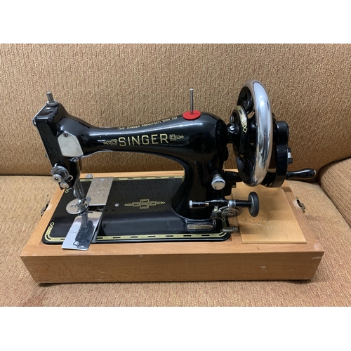 430 - A vintage manual Singer sewing machine in carry case