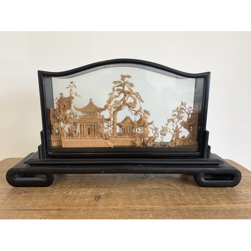 47 - A vintage well carved Chinese cork diorama in ornate case, 19 1/2