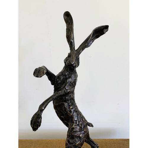 58 - A bronzed resin 'dancing hare', approx. 20