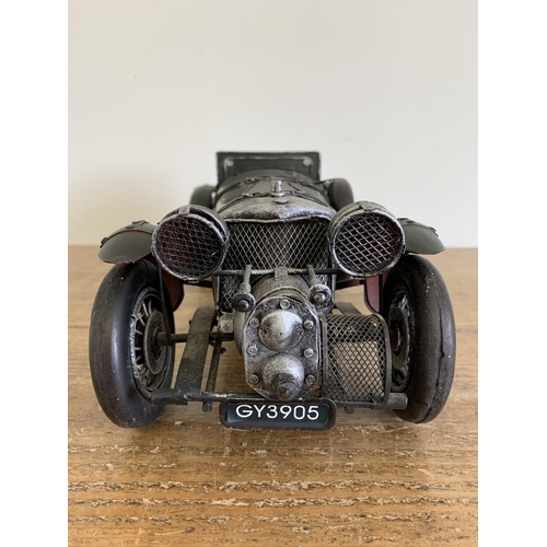 64 - A tin plate model vintage racing car, 15