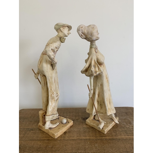 69 - A pair of early 20th Century Art Nouveau Austrian ceramic figurines of croquet players, the tallest ... 