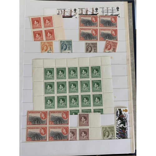 76 - Two albums of mid century world stamps, some as singles, many in part sheets