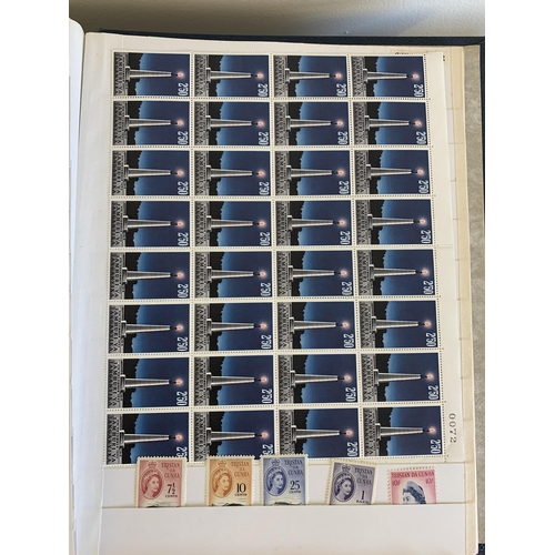 76 - Two albums of mid century world stamps, some as singles, many in part sheets