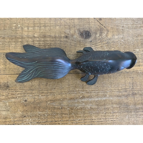 78 - A vintage bronze fan tail gold fish, 13 3/4