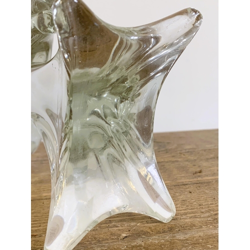 83 - A large crystal glass bird signed 'Louette' to base, approx. 15