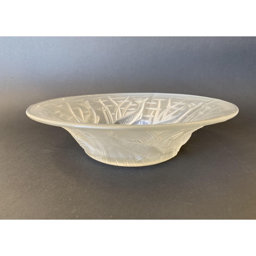 98 - An ornate moulded glass bowl decorated with fish, 8 1/4