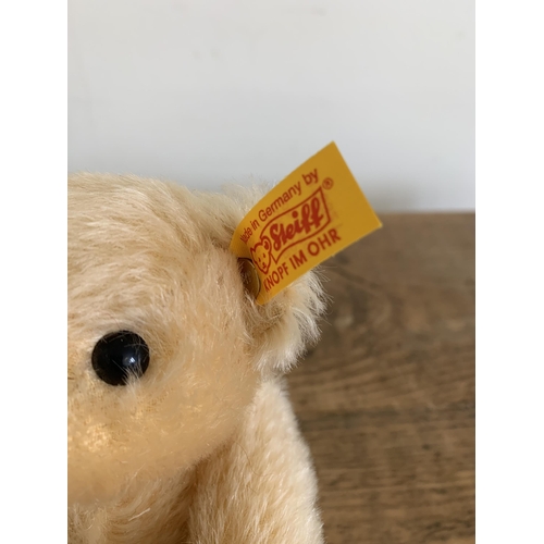 47 - Three Steiff teddy bears, a light blond with ball, approx. height 8