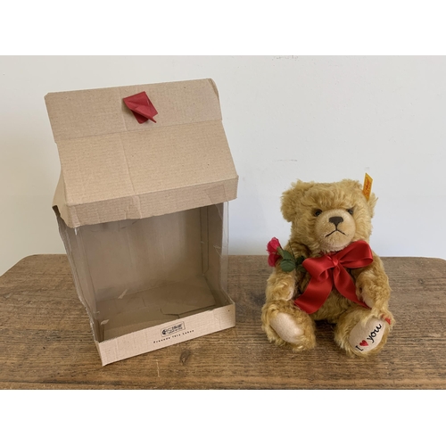 49 - A boxed Steiff teddy bear with rose 'I Love You', approx. height 8 1/2