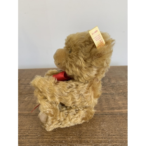 49 - A boxed Steiff teddy bear with rose 'I Love You', approx. height 8 1/2