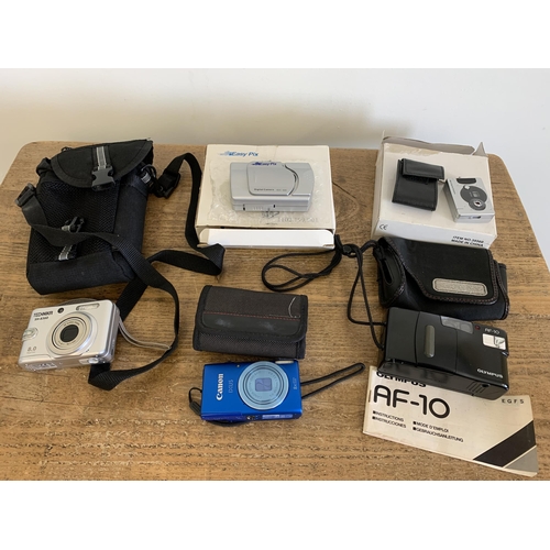 71 - An Olympus AF-10 camera, a Technika SH-8360, a Canon IXUS, Easy Pix XDC-300 and a mini digital camer... 