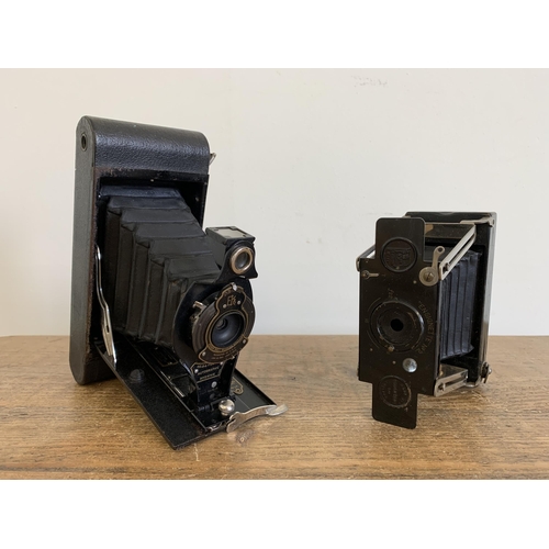 74 - A vintage Houghton's Ltd England 'Ensignette No.2' camera together with a vintage Kodak No.2 - a fol... 