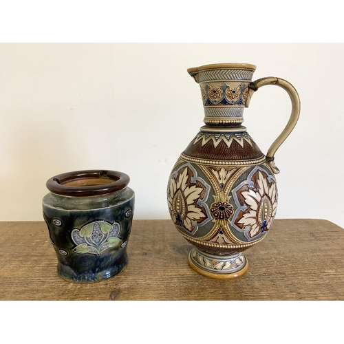 86 - A vintage Art Nouveau period Royal Doulton tobacco jar (lacking lid) plus an Austrian Mettlach jug, ... 