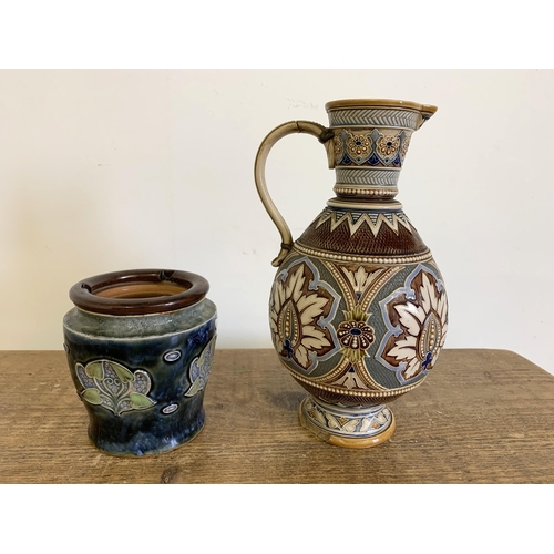 86 - A vintage Art Nouveau period Royal Doulton tobacco jar (lacking lid) plus an Austrian Mettlach jug, ... 