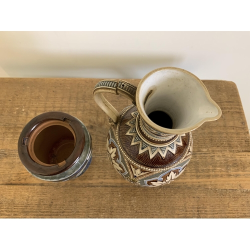 86 - A vintage Art Nouveau period Royal Doulton tobacco jar (lacking lid) plus an Austrian Mettlach jug, ... 