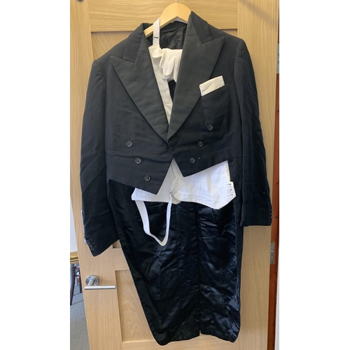 87 - A vintage butlers style jacket with tails, white waistcoat and white gloves, the jacket retailed thr... 