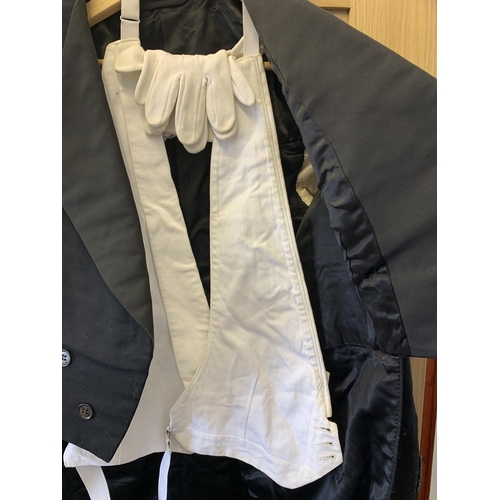 87 - A vintage butlers style jacket with tails, white waistcoat and white gloves, the jacket retailed thr... 