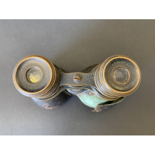 91 - A pair of vintage Negretti & Zambra small binoculars (dirty, but clear lenses, outer cover as found)... 