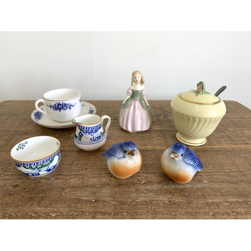 98 - Royal Doulton 'Penny' figure HN2338, a Doulton 'Merryweather' pattern small jug and bowl, Crown Devo... 