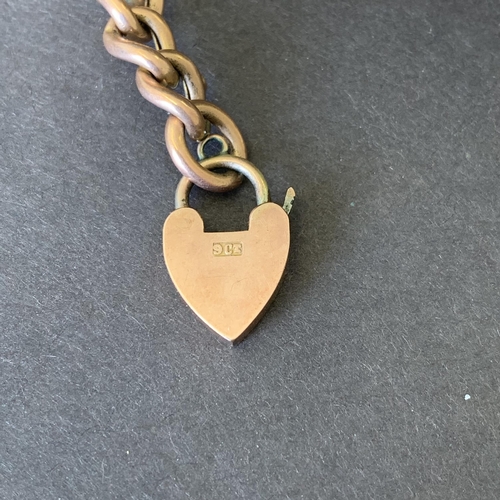 116 - A 9ct rose gold heart shaped locket on a rose coloured chain bracelet, each link is marked '9' or '6... 