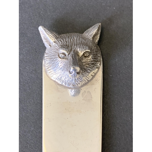 122 - A heavy hallmarked silver page marker surmounted with a fox head, well marked for Birmingham 1979, m... 