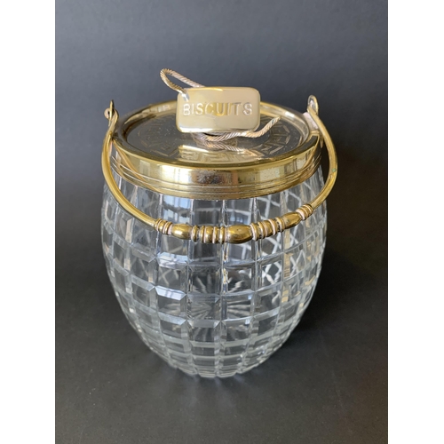 123 - A vintage silver plate and cut glass biscuit barrel on stand finished with a coiled rope handle (wea... 