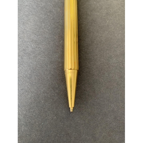 150 - A vintage 'Must De' Cartier gold plated propelling pencil, just over 5 1/4