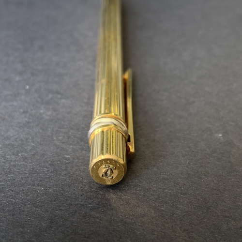 150 - A vintage 'Must De' Cartier gold plated propelling pencil, just over 5 1/4