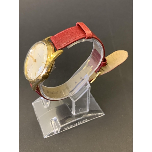 201 - A vintage Garrard Automatic wristwatch, rolled gold G10, on red leather strap, 32mm dia (running at ... 