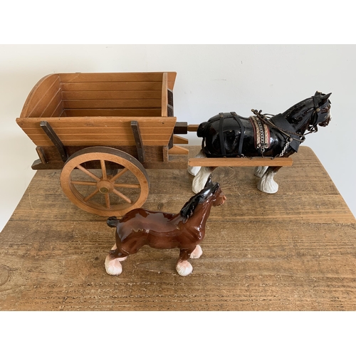 21 - A ceramic heavy horse with wood cart (as found ear) plus a smaller horse