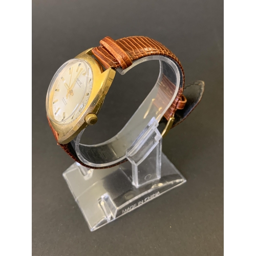 212 - A vintage Montine Automatic wristwatch on brown leather strap, 34mm dia (running at the time of lott... 