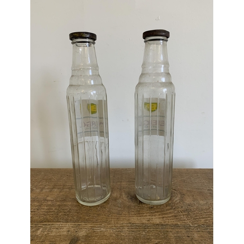 231 - A pair of vintage BP 'Energol' motor oil glass bottles