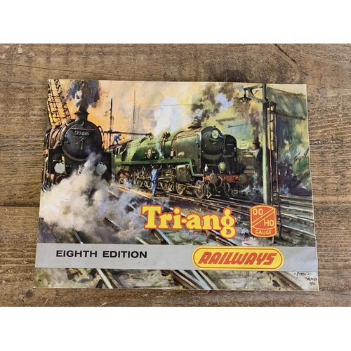 77 - A boxed Tri-ang RS.24 electric model railway (playwear and box distressed) plus carriages, boxed ten... 